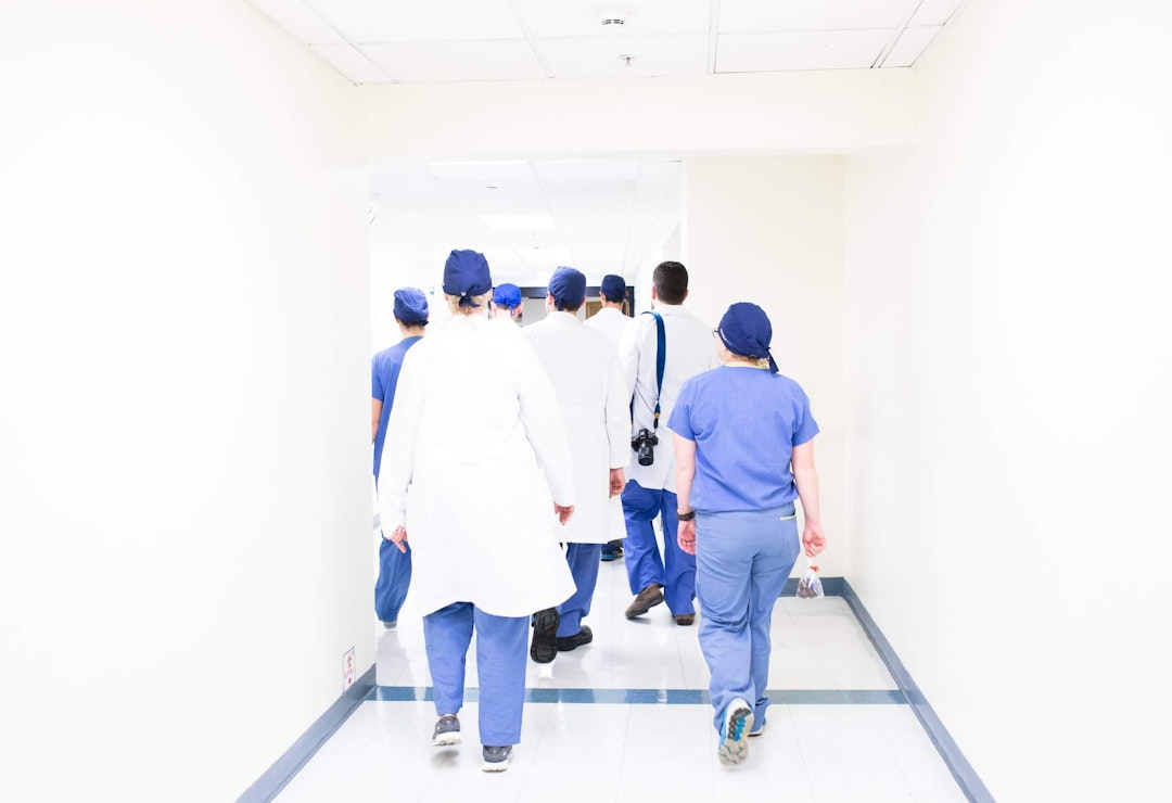 Healthcare employees walking in hallway